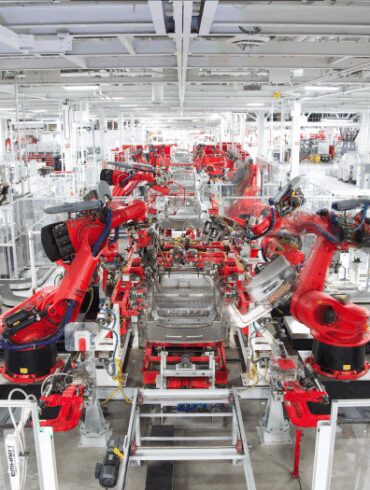Tesla model y elon musk production manufacturing revolution