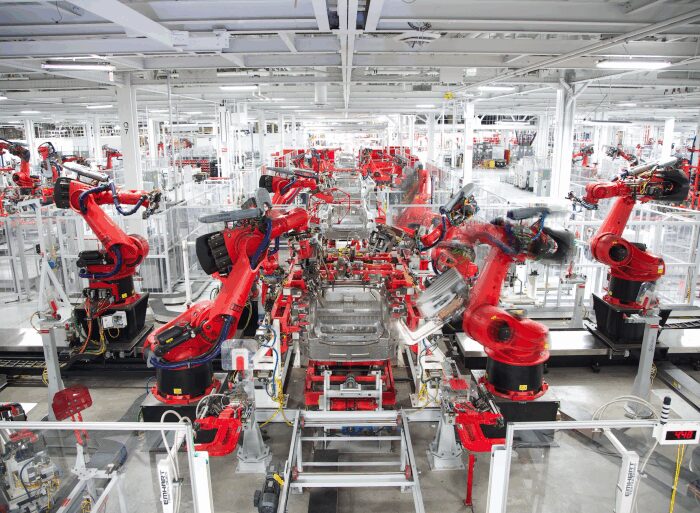 Tesla model y elon musk production manufacturing revolution