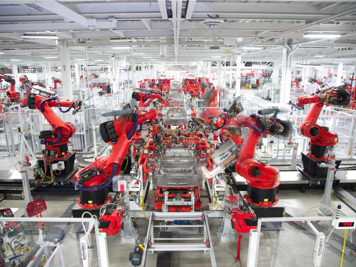 Tesla model y elon musk production manufacturing revolution