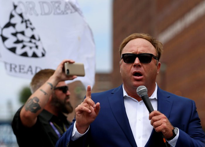 Alex jones infowars apple itunes podcasts removed