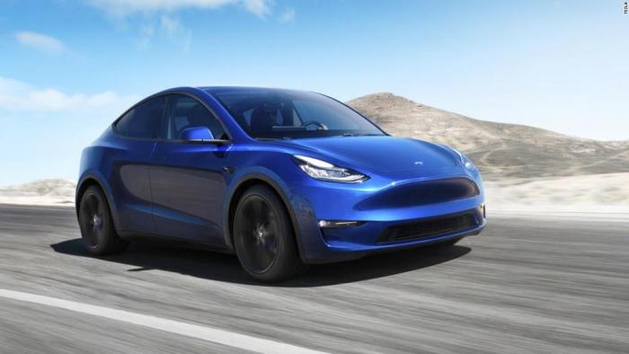 Tesla model y elon musk production manufacturing revolution